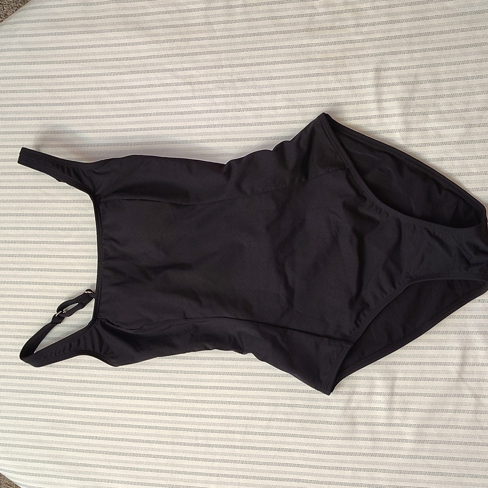 Adorable black one piece with lace up back in small.